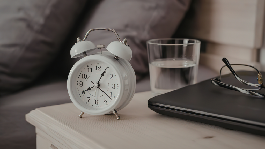 A picture of a clock and a laptop